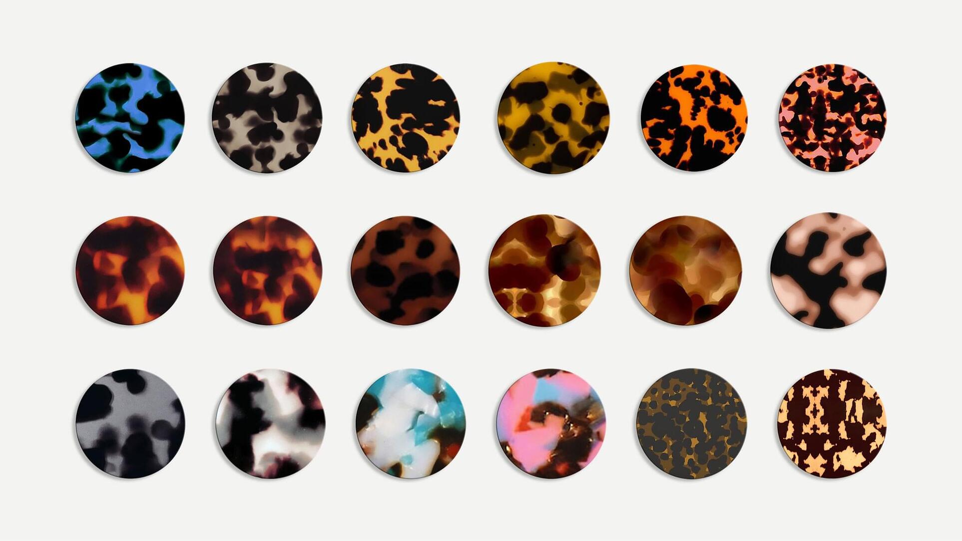 A colorful palette of 18 tortoise shell patterns, ranging from brown, blue, red and white.